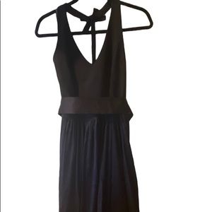 Vera Wang black halter bridesmaid dress with belt and pockets.